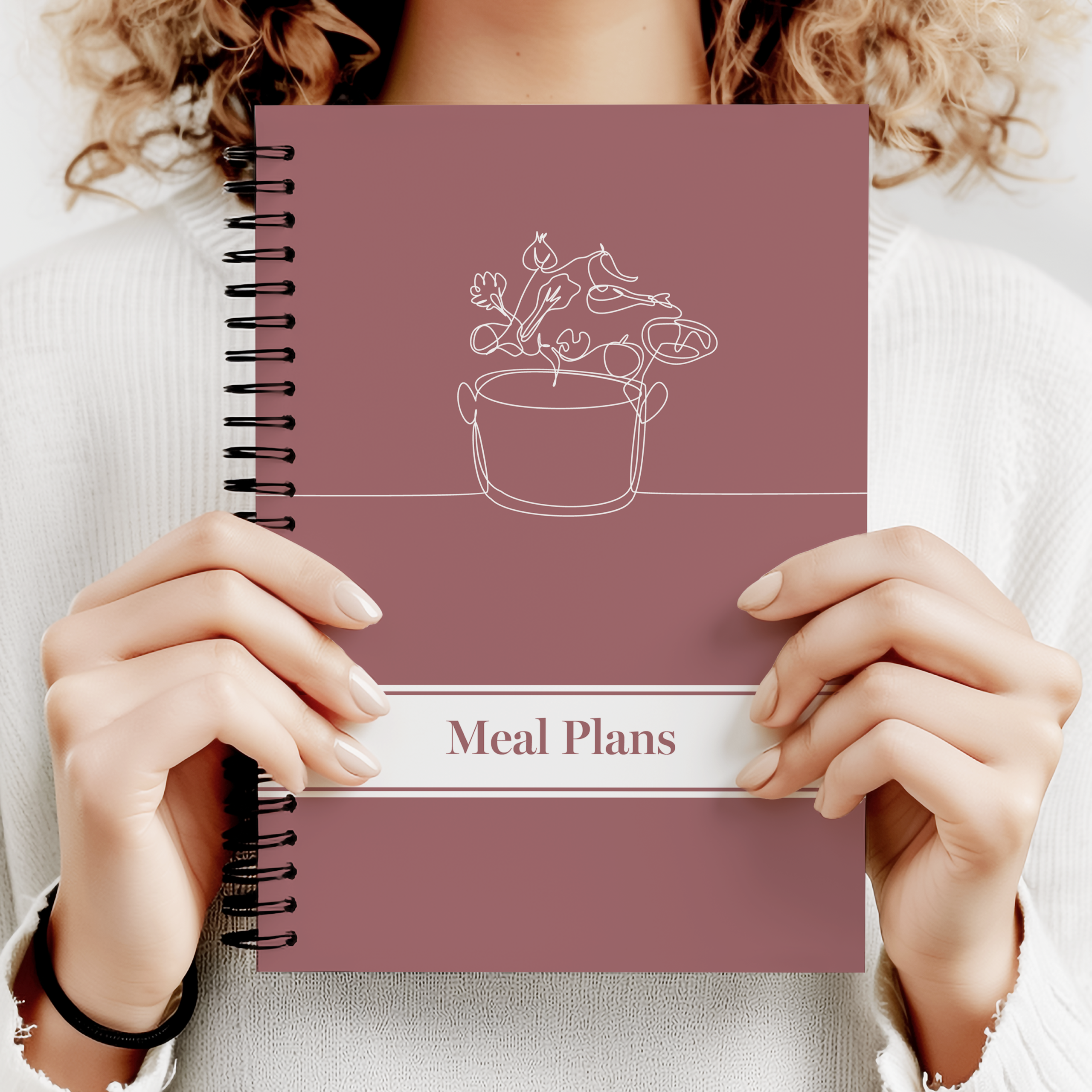 Image of a weekly meal plan notebook with grocery list